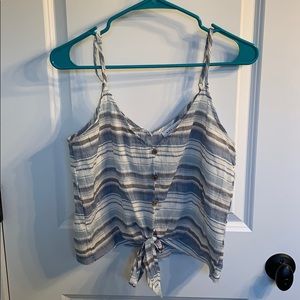 a blue, grey, and white striped tank top